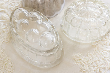 Fototapeta na wymiar Old fashioned glass and aluminum jelly or blancmange moulds for making traditional jellies