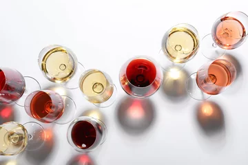 Poster Different glasses with wine on white background, top view © New Africa
