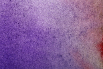 purple colorful watercolor paint spill on textured background