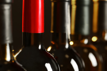 Bottles of different wines, closeup. Expensive collection