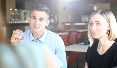 Colleagues sitting in cafe