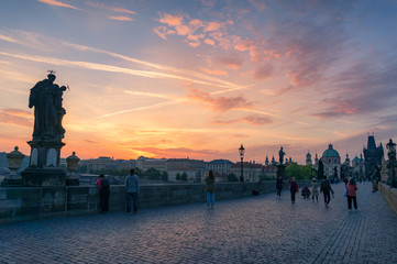 Historic Charles bridge with unidentifiable people taking photos