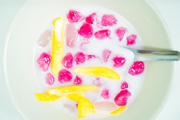 Waterchestnut in coconut milk Thai desserts, delicious The milk in the royal palace of Thailand, top view White background