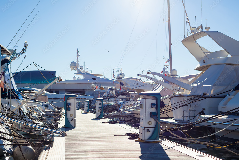 Wall mural moored yachts charching with fuel and electricity