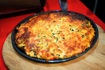 Custom made pizzas at home on appetizing brown wooden trays