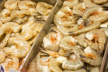 A display case full of raw shrimp