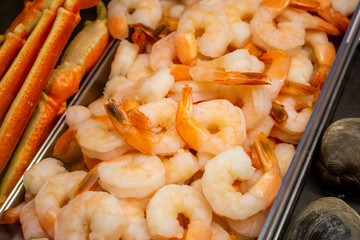 A display case full of cooked shrimp 