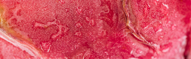 panoramic shot of wet exotic ripe dragon fruit pink peel