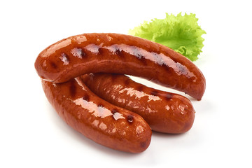 Grilled pork sausages with lettuce, close-up, isolated on white background