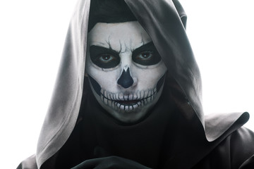 front view of woman with skull makeup looking at camera isolated on white