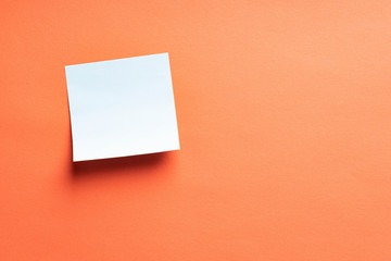 Blank blue sticker on peach color background. Copy space Creative vintage background. Template for lettering