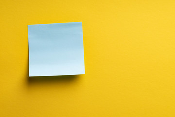 Blank blue sticker on yellow color background. Copy space Creative vintage background. Template for lettering