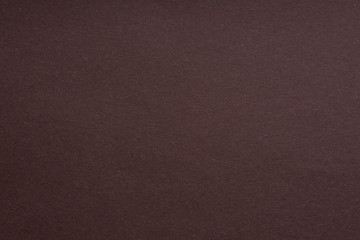 Paper background brown color. Rough paper texture. Closeup. Macro.