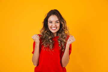 Portrait of a lovely cheerful young woman standing