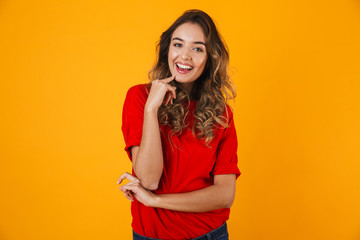 Portrait of a lovely cheerful young woman standing