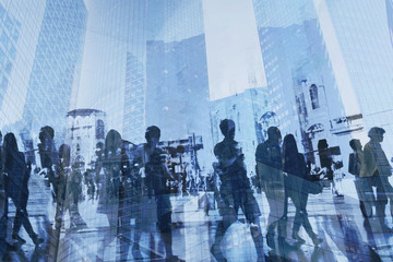 double exposure of business people walking on busy street of modern city, office buildings...