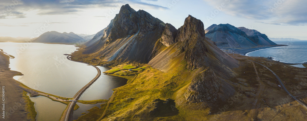 Wall mural scenic road in iceland, beautiful nature landscape aerial panorama, mountains and coast at sunset