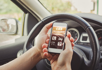 car insurance concept, person driver reading website on smartphone screen