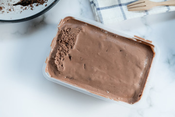 Ice cream chocolate in a plastic container