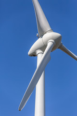 Detailed close up view of a wind turbines; generator, rotor and blade view