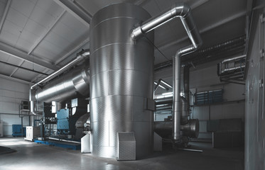 Rankine organic cycle turbine (ORC-turbine) installed in the boiler room. Blue toning