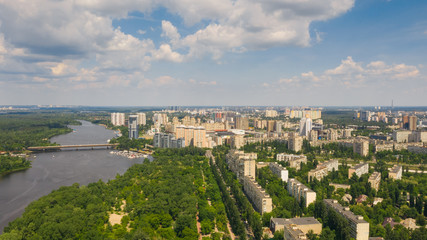 Birds eye view on cityscape, skyline and coastline of Dnieper River near Rusanivka island at summer time. (Kyiv, Kiev) Ukraine.