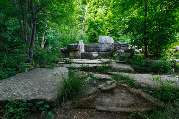 Ancient round ruined dolmen in the valley of the river Jean, Monument of archeology megalithic...