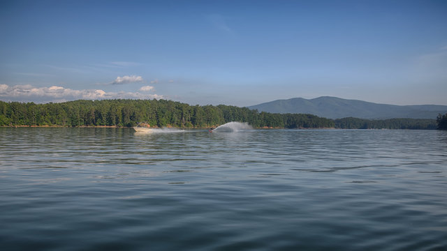 "Doing the Slalom" a slalom water skier on a spring morning ZDS Lake Jame Collection