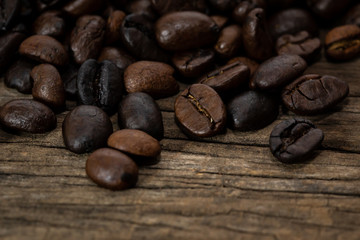 Coffee beans on old wood background
