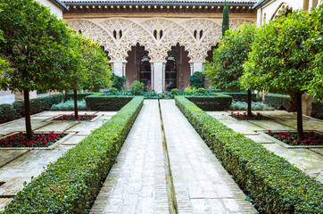 Zaragoza, Aragon, Spain - February 14th, 2019 : Courtyard of Santa Isabel inside the Moorish Taifal Aljafería Palace Unesco World Heritage Site.