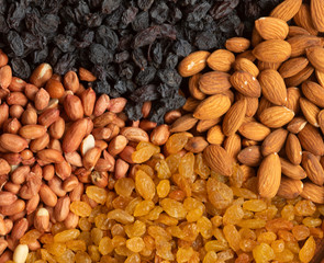 Golden raisins on a plate on white background, top view. Space for text - Image