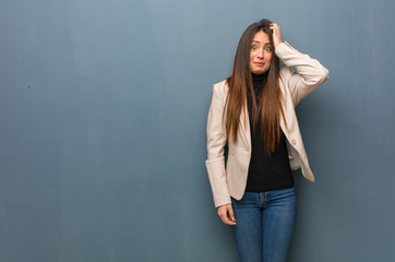 Young business woman worried and overwhelmed
