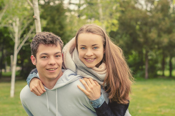 Fototapeta premium Christian friendship. Two happy friends laughing and hugging outdoors.