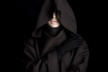 front view of beautiful woman in death costume isolated on black