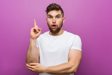 Young handsome caucasian man having some great idea, concept of creativity.
