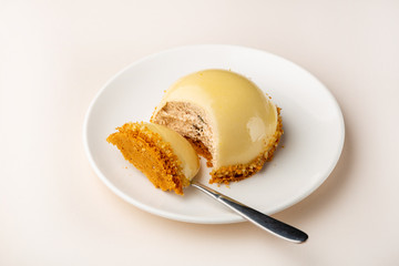 Yellow modern dessert on plate