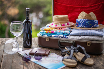 Suitcase preparation for a summer holiday , Retro , vintage and old luggage   