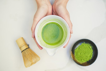 tea master made matcha green tea and bamboo whisk