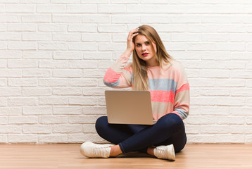 Young russian student woman sitting tired and very sleepy