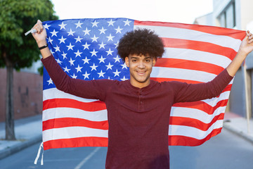 Teenager guy with a open american flag