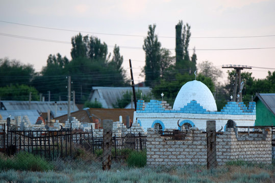 View of beautiful small Muslim graveyard outdoors with stone tombs