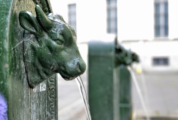 A triptych of drinking water fountains