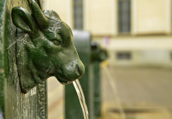 A triptych of drinking water fountains