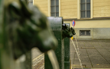 A triptych of drinking water fountains