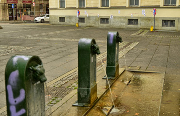 A triptych of drinking water fountains