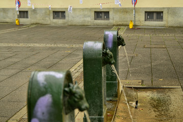 A triptych of drinking water fountains