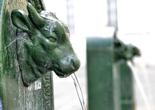 A triptych of drinking water fountains