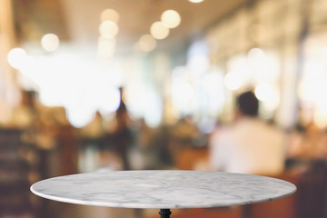 round marble table top with cafe restaurant bokeh lights abstract background for montage product...