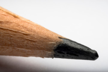 Closeup detail of the tip of a black pencil