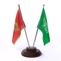 Montenegro and Saudi Arabia, two table flags isolated on white background. 3d image